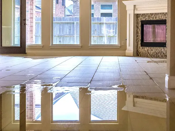 Standing water across a tile floor in a Monroe, NC home