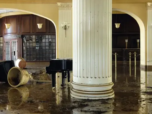 Water across the floor of a large commercial hall after a water loss